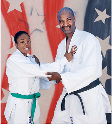 Picture of father and daughter martial artists